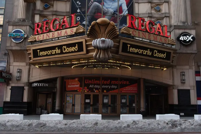 A Regal cinema in Times Square has its marquee say "Temporarily closed"